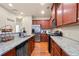 Stylish kitchen boasts granite counters, stainless steel appliances, and ample cabinet space at 3229 Hallmark Ln, Buford, GA 30519