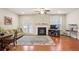 Inviting living room features a fireplace, hardwood floors, and a walk-out to the deck at 3229 Hallmark Ln, Buford, GA 30519