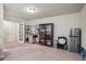 Spacious living area with carpet, access to backyard, and appliance connections at 3229 Hallmark Ln, Buford, GA 30519
