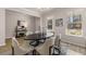 Bright dining room features an oval table, six chairs, natural light from two large windows, and modern decor at 4549 Ajo Lot#30 Walk, Atlanta, GA 30331