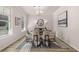 Elegant dining room with modern decor, ample natural light, a round table, and seating for six at 4549 Ajo Lot#30 Walk, Atlanta, GA 30331