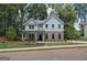 Charming two-story home showcasing light blue siding, brick accents, and a well-manicured front yard at 4549 Ajo Lot#30 Walk, Atlanta, GA 30331