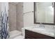 Clean bathroom with tiled shower, granite vanity, and a stylish mirror at 520 Tackett Farms Rd, Smyrna, GA 30082