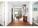 Inviting foyer featuring hardwood floors, staircase, and an open view into adjacent living spaces at 520 Tackett Farms Rd, Smyrna, GA 30082
