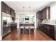 Modern kitchen features dark wood cabinets, stainless appliances, and an open layout at 520 Tackett Farms Rd, Smyrna, GA 30082