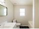 Bright bathroom featuring modern fixtures, hexagon tile floor and a large mirror at 265 Mountainview Dr, Covington, GA 30016