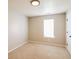 Bedroom featuring carpet, a window, and a white door at 265 Mountainview Dr, Covington, GA 30016
