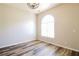 Bright bedroom with new flooring and a large window at 265 Mountainview Dr, Covington, GA 30016
