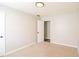 Cozy bedroom with neutral carpet, a ceiling light, and a walk-in closet at 265 Mountainview Dr, Covington, GA 30016
