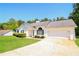 Charming single-Gathering home featuring a well-manicured lawn and a two-car garage at 265 Mountainview Dr, Covington, GA 30016