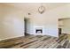Inviting living room boasts modern wood flooring and a cozy fireplace at 265 Mountainview Dr, Covington, GA 30016
