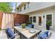 Charming outdoor dining area on the patio, complete with a stylish table setting and privacy fence at 1906 Variations Ne Dr, Atlanta, GA 30329