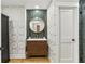 Stylish bathroom with modern vanity, eye-catching wallpaper, and tiled shower at 1906 Variations Ne Dr, Atlanta, GA 30329