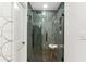 Modern bathroom features a glass shower with vertically stacked tiles and hexagon floor at 1906 Variations Ne Dr, Atlanta, GA 30329