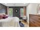 Well-lit bedroom boasts modern decor, including a statement wall at 1906 Variations Ne Dr, Atlanta, GA 30329