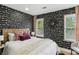 Inviting bedroom features modern decor, including a statement wall at 1906 Variations Ne Dr, Atlanta, GA 30329