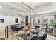 Modern dining area with glass table, blue chairs and access to outdoor balcony at 1906 Variations Ne Dr, Atlanta, GA 30329