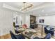 Modern dining area with a glass table, stylish blue chairs, and a chic light fixture at 1906 Variations Ne Dr, Atlanta, GA 30329