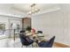 Bright dining room with modern chandelier, stylish decor and balcony view to outdoor patio at 1906 Variations Ne Dr, Atlanta, GA 30329