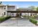 Townhouse complex with covered parking and nicely landscaped walkway at 1906 Variations Ne Dr, Atlanta, GA 30329