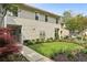 Inviting townhouse with well-manicured front yard and charming landscaping at 1906 Variations Ne Dr, Atlanta, GA 30329