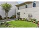 Home exterior with manicured lawn, flowerbeds, and walkway to entrance at 1906 Variations Ne Dr, Atlanta, GA 30329