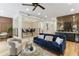 Open-concept living room with a modern dining area, stylish bar area, and beautiful hardwood flooring at 1906 Variations Ne Dr, Atlanta, GA 30329