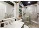 Modern bathroom featuring a glass shower, stone pebble floor, and custom sink with a large mirror at 338 Patricia Sw Ave, Marietta, GA 30060