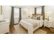 Comfortable bedroom with wood floors, stylish curtains, a queen bed, and soft, neutral decor at 338 Patricia Sw Ave, Marietta, GA 30060