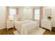 Cozy bedroom with a queen bed, bedside tables, and soft pink accents for a relaxing atmosphere at 338 Patricia Sw Ave, Marietta, GA 30060