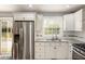 Modern kitchen featuring stainless steel appliances, white cabinets, and lots of counter space at 338 Patricia Sw Ave, Marietta, GA 30060