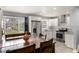 Open-concept kitchen flowing into dining area with stainless steel appliances and modern finishes at 338 Patricia Sw Ave, Marietta, GA 30060