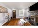 Inviting living room featuring hardwood floors, a decorative fireplace, and a cozy atmosphere at 338 Patricia Sw Ave, Marietta, GA 30060
