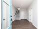 Inviting entryway with hardwood floors, staircase, and a clear view of the home's interior layout at 524 Aberdeen Mdw, Acworth, GA 30102