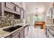 Functional kitchen featuring gray cabinetry, granite countertops, and modern appliances at 7450 Chads Cir, Jonesboro, GA 30236