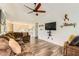 Spacious living room featuring plush furniture, a ceiling fan, and elegant decor at 7450 Chads Cir, Jonesboro, GA 30236