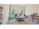 Bright bedroom featuring a four-poster bed, and large windows, creating a cozy, cheerful space at 3065 Arbor Song Ct, Cumming, GA 30041