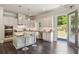 Well-appointed kitchen with stainless appliances, a center island with seating, and easy access to the outdoor space at 3065 Arbor Song Ct, Cumming, GA 30041