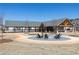 Community fire pit area with seating and a covered outdoor kitchen area in the background at 512 Aberdeen Meadow Ln, Acworth, GA 30102
