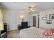 Cozy bedroom with ceiling fan, neutral carpeting, and a tranquil setting for relaxation and rest at 5570 Stonewood Ct, Norcross, GA 30093
