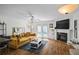 Bright living room with hardwood floors, fireplace, and French doors to the backyard, creating a cozy atmosphere at 5570 Stonewood Ct, Norcross, GA 30093
