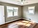Cozy bedroom with ample natural light from two windows and sleek wood flooring at 1277 4Th Ave, Auburn, GA 30011