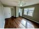 Spacious bedroom featuring closet, wood floors, a ceiling fan, and ample natural light at 1277 4Th Ave, Auburn, GA 30011