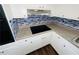 Updated kitchen offering white cabinetry, stainless appliances, and stylish backsplash at 1277 4Th Ave, Auburn, GA 30011