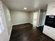 Living area featuring wood-look flooring, natural light, and neutral walls at 1277 4Th Ave, Auburn, GA 30011