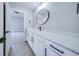 Bathroom with a long white vanity and a round mirror at 175 Paislee Park (Lot # 11 Paislee Park) Dr, Fayetteville, GA 30215