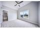 Bedroom featuring carpet, a ceiling fan, and a window with trim at 175 Paislee Park (Lot # 11 Paislee Park) Dr, Fayetteville, GA 30215