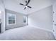 Spacious bedroom featuring a ceiling fan and natural light from two windows at 175 Paislee Park (Lot # 11 Paislee Park) Dr, Fayetteville, GA 30215