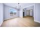 Airy dining room with hardwood floors, chandelier, and a large window offering views at 175 Paislee Park (Lot # 11 Paislee Park) Dr, Fayetteville, GA 30215
