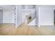 Spacious foyer with gleaming hardwood floors, leading to a staircase and other rooms at 175 Paislee Park (Lot # 11 Paislee Park) Dr, Fayetteville, GA 30215